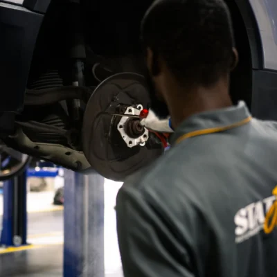 Car brake disc inspection before rotor replacement